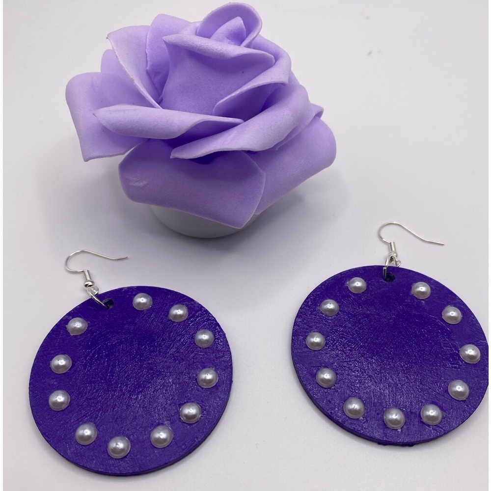 Purple and white wood with pearls. 2”